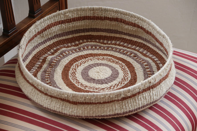 Colored chaguar basket, striped fabric, chair