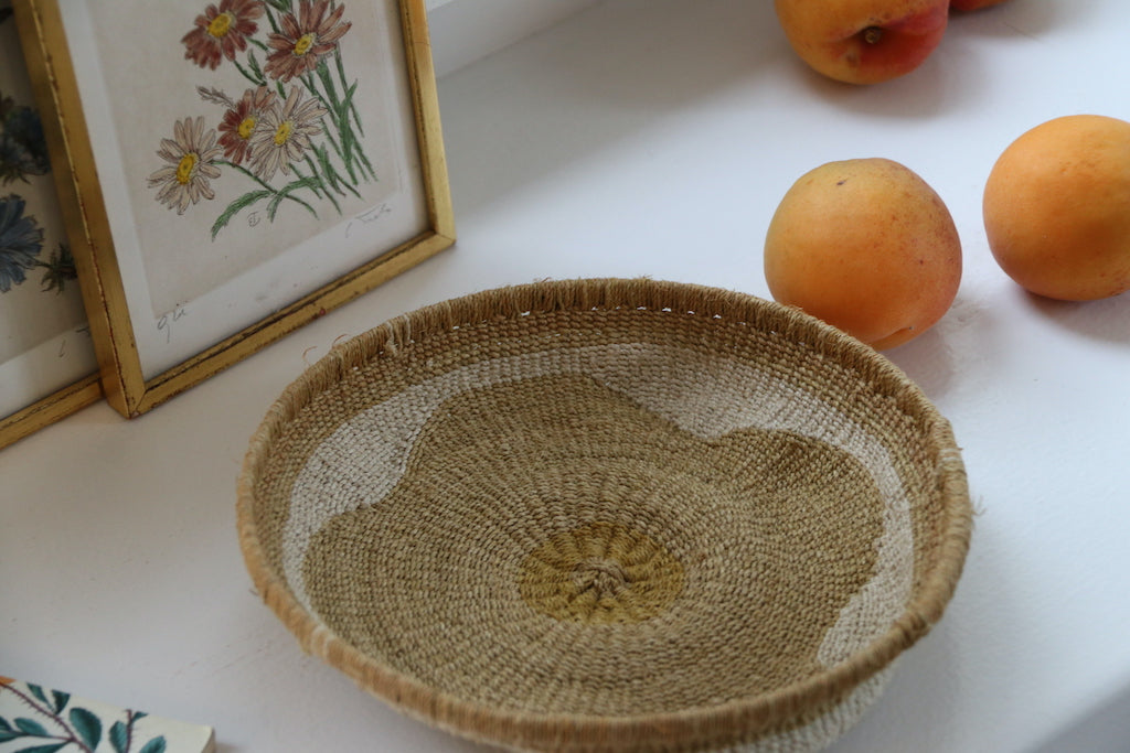 Colored basket with floral paintings and peaches